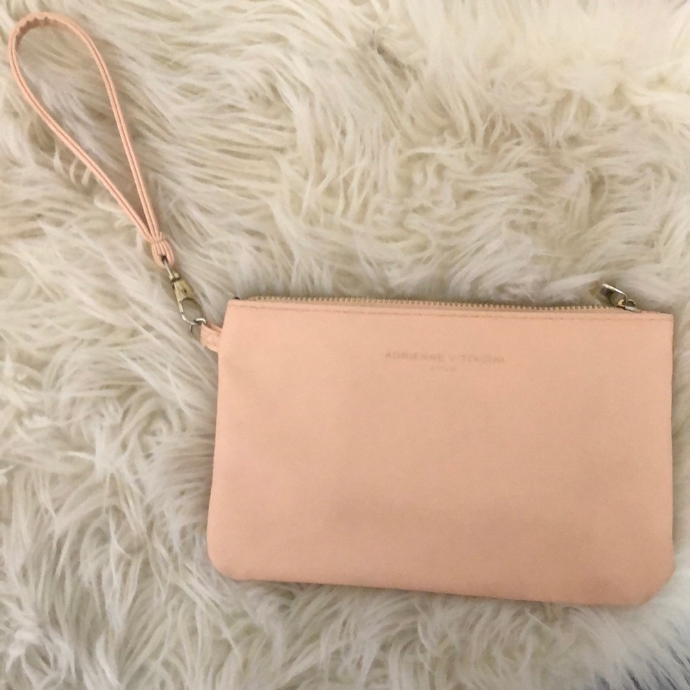 Blush colored wristlet with portable charger